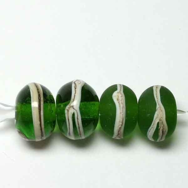 Singles, pairs or set of 10 - Transparent dark grass green with silvered ivory stringer